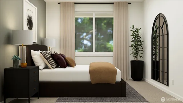 a bedroom with a bed and a night stand