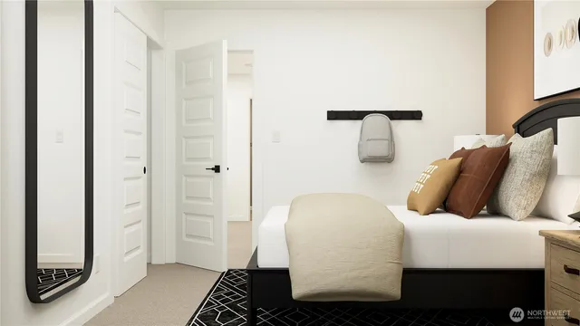 a bathroom with a toilet sink a mirror a vanity and shower