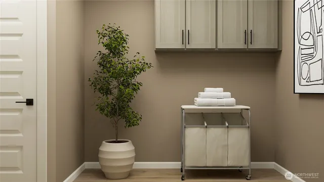 a picture of a room with a white wall and a refrigerator