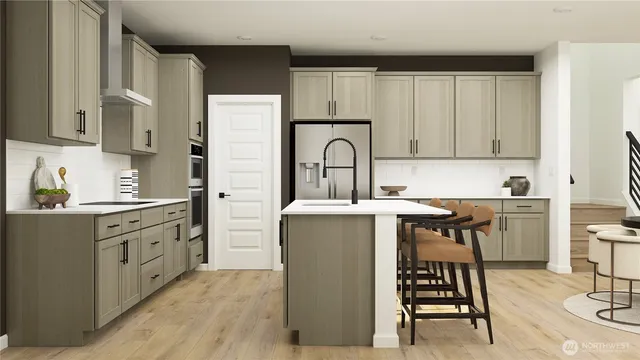 a kitchen with cabinets and chairs
