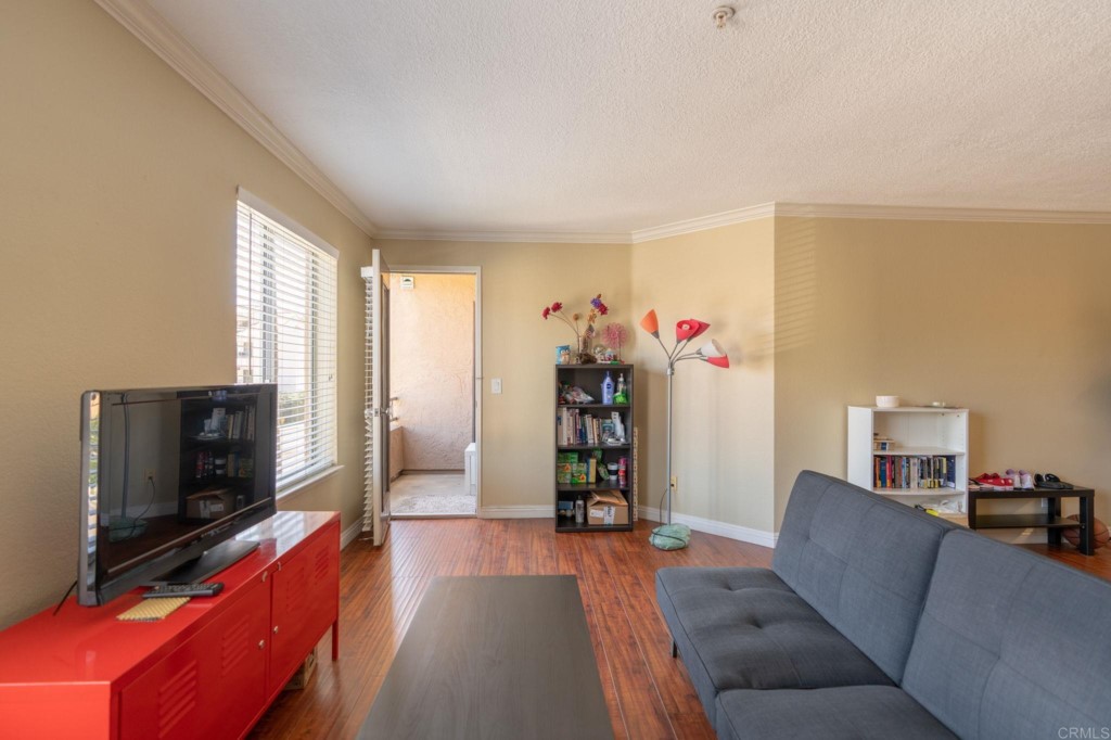 3550 Lebon Drive, Unit 6210 San Diego, CA 92122 - Photo 1 of 20 a living room with furniture and a flat screen tv
