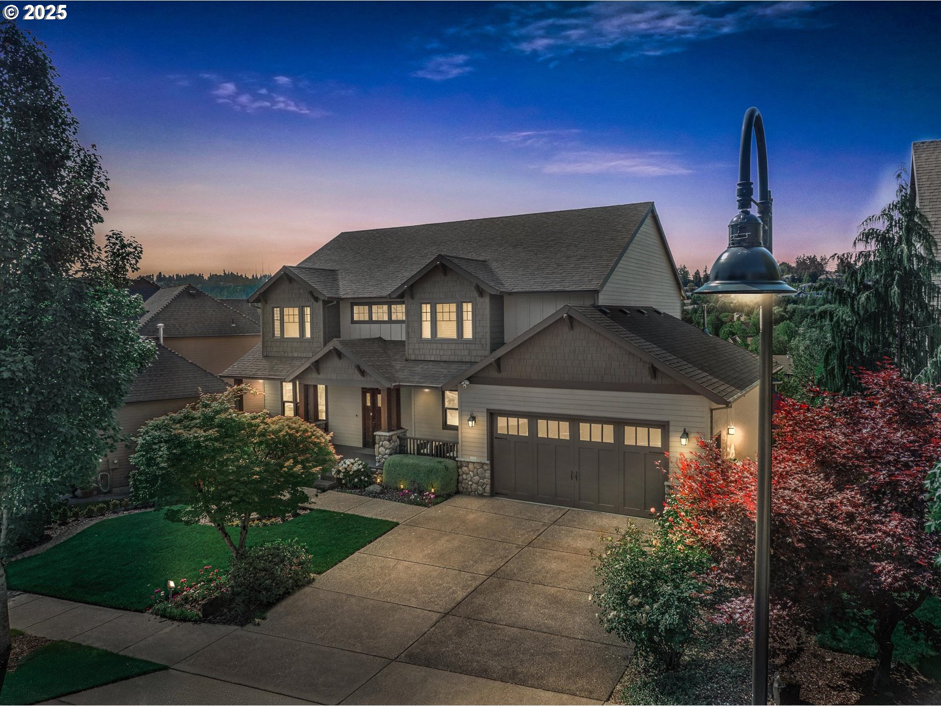 14697 Southeast Poppy Hills Drive Happy Valley, OR 97086 - Photo 1 of 48 a front view of a house with a garden