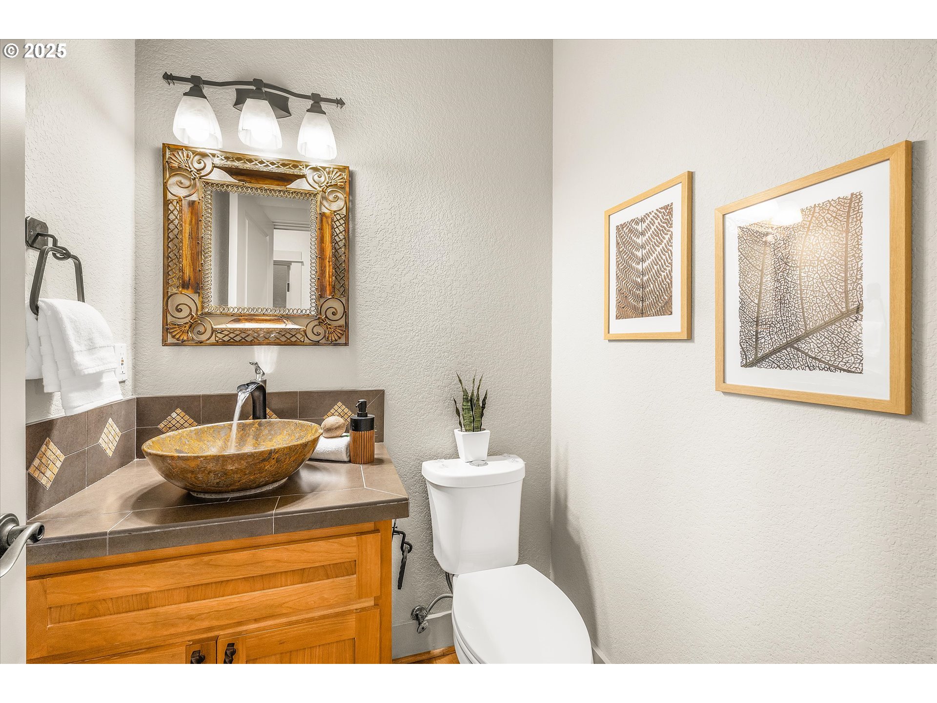 14697 Southeast Poppy Hills Drive Happy Valley, OR 97086 - Photo 16 of 48 a bathroom with a toilet sink and mirror