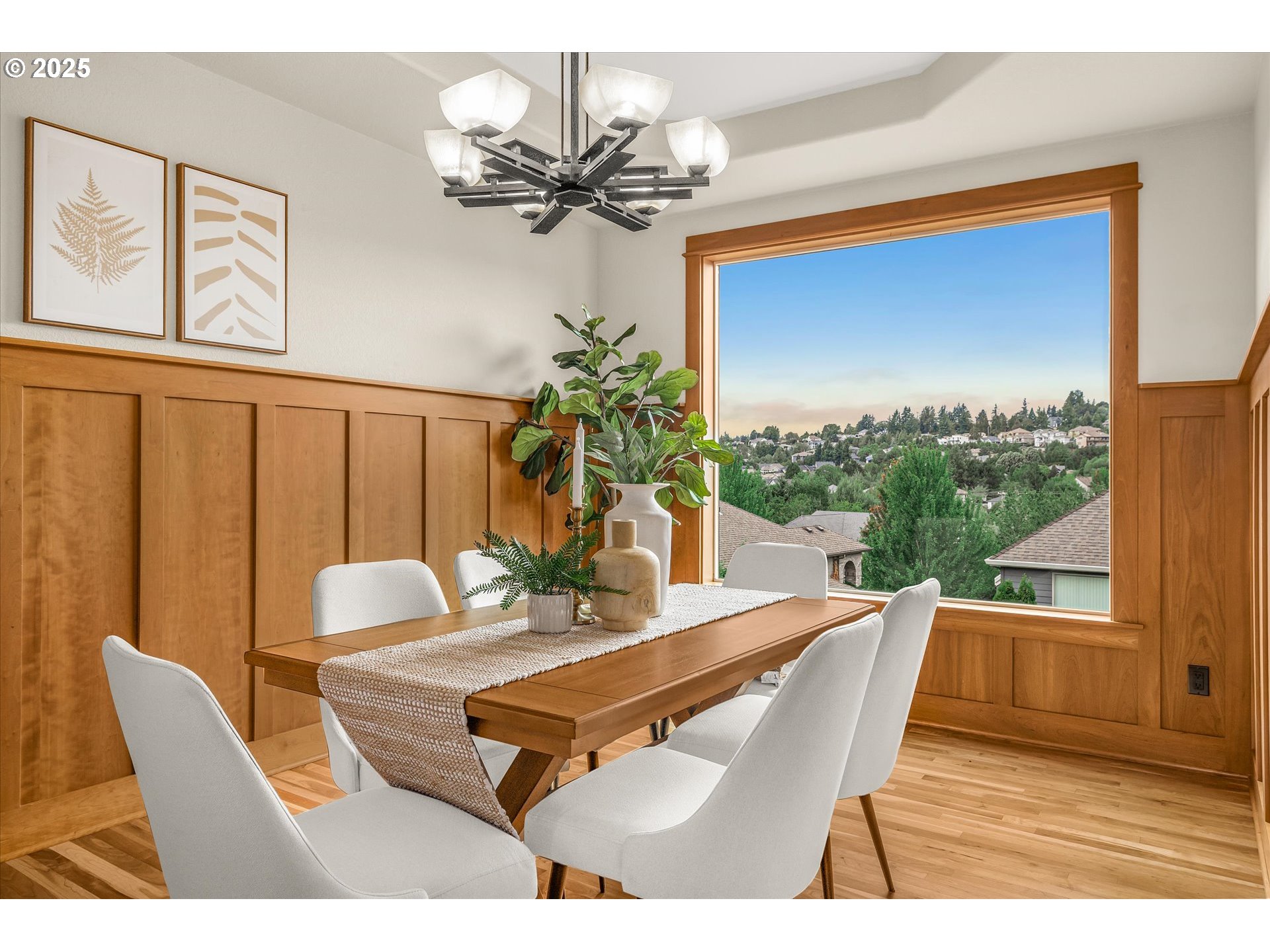 14697 Southeast Poppy Hills Drive Happy Valley, OR 97086 - Photo 17 of 48 a dining room with furniture a large window and a chandelier
