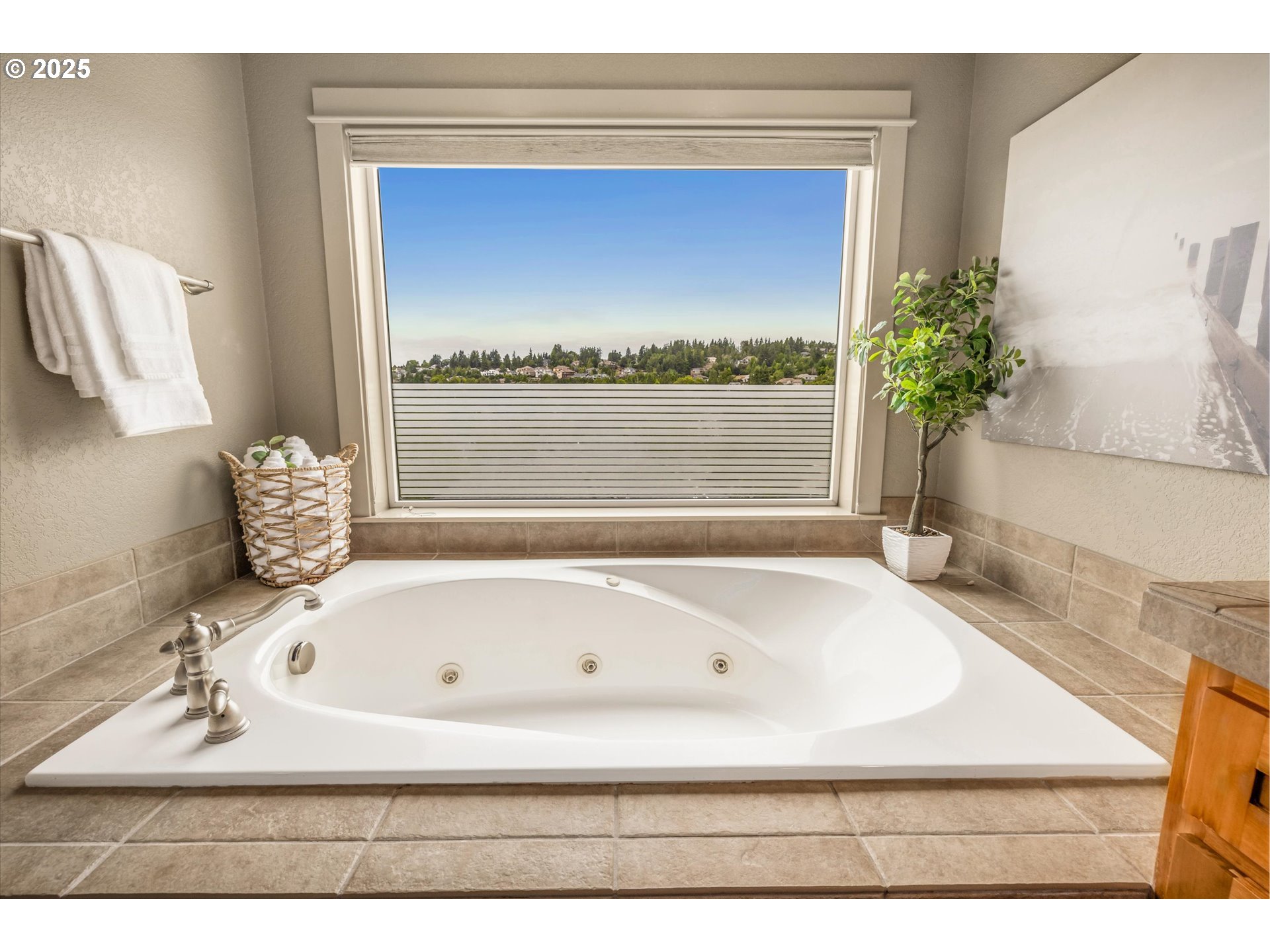 14697 Southeast Poppy Hills Drive Happy Valley, OR 97086 - Photo 24 of 48 a bathroom with a bathtub and a window
