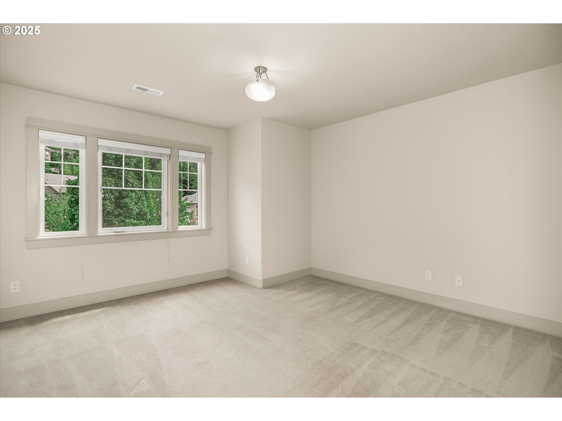 14697 Southeast Poppy Hills Drive Happy Valley, OR 97086 - Photo 26 of 48 a view of an empty room with a window