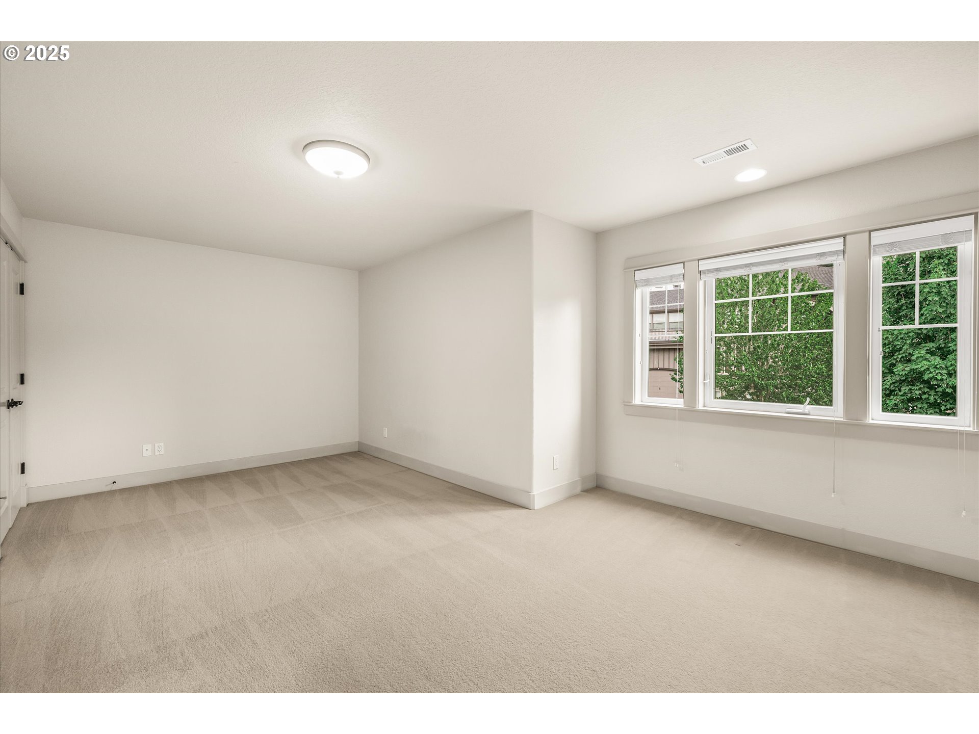 14697 Southeast Poppy Hills Drive Happy Valley, OR 97086 - Photo 30 of 48 an empty room with windows