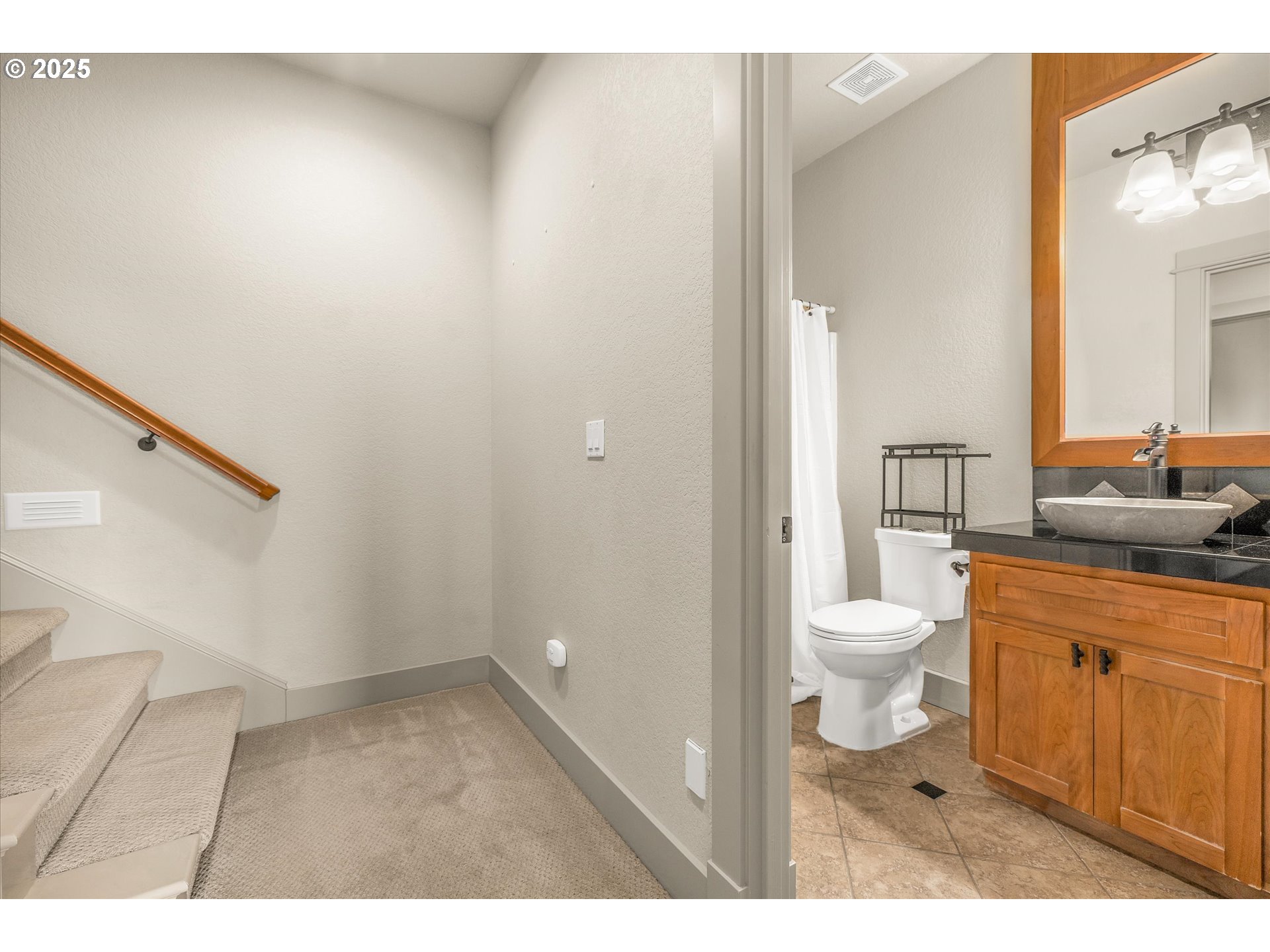 14697 Southeast Poppy Hills Drive Happy Valley, OR 97086 - Photo 32 of 48 a bathroom with a toilet a sink and shower