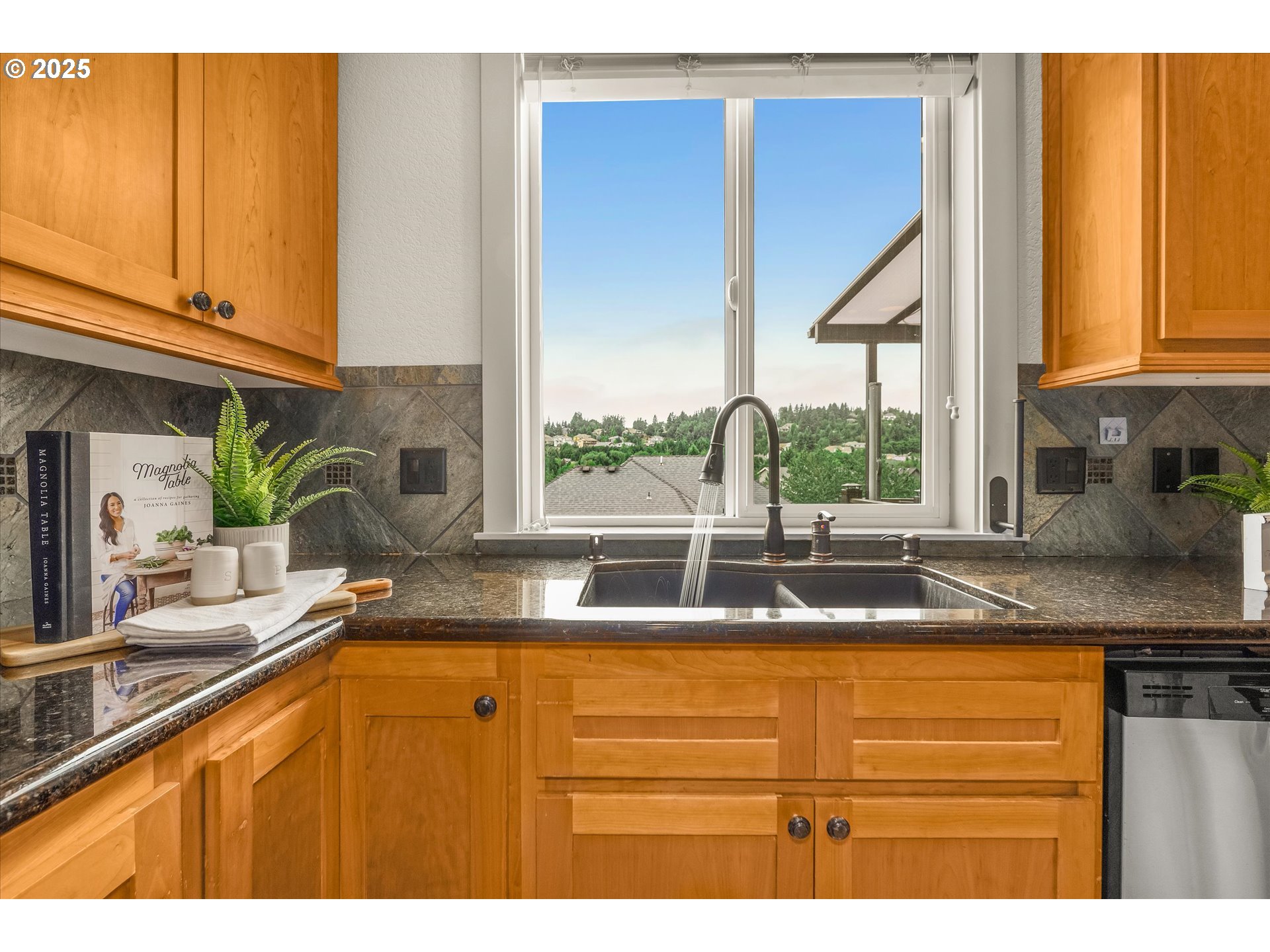 14697 Southeast Poppy Hills Drive Happy Valley, OR 97086 - Photo 9 of 48 a kitchen with sink and window