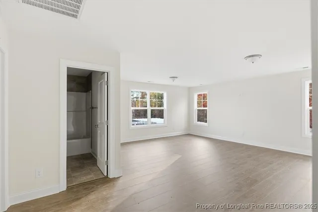 a view of a kitchen with a sink and cabinets