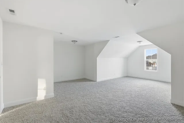 a view of an house with backyard space and porch area