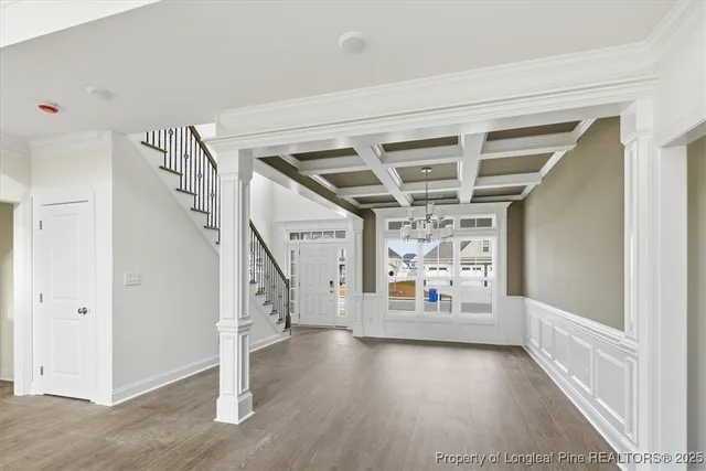 a view of entryway with stairs and wooden floor