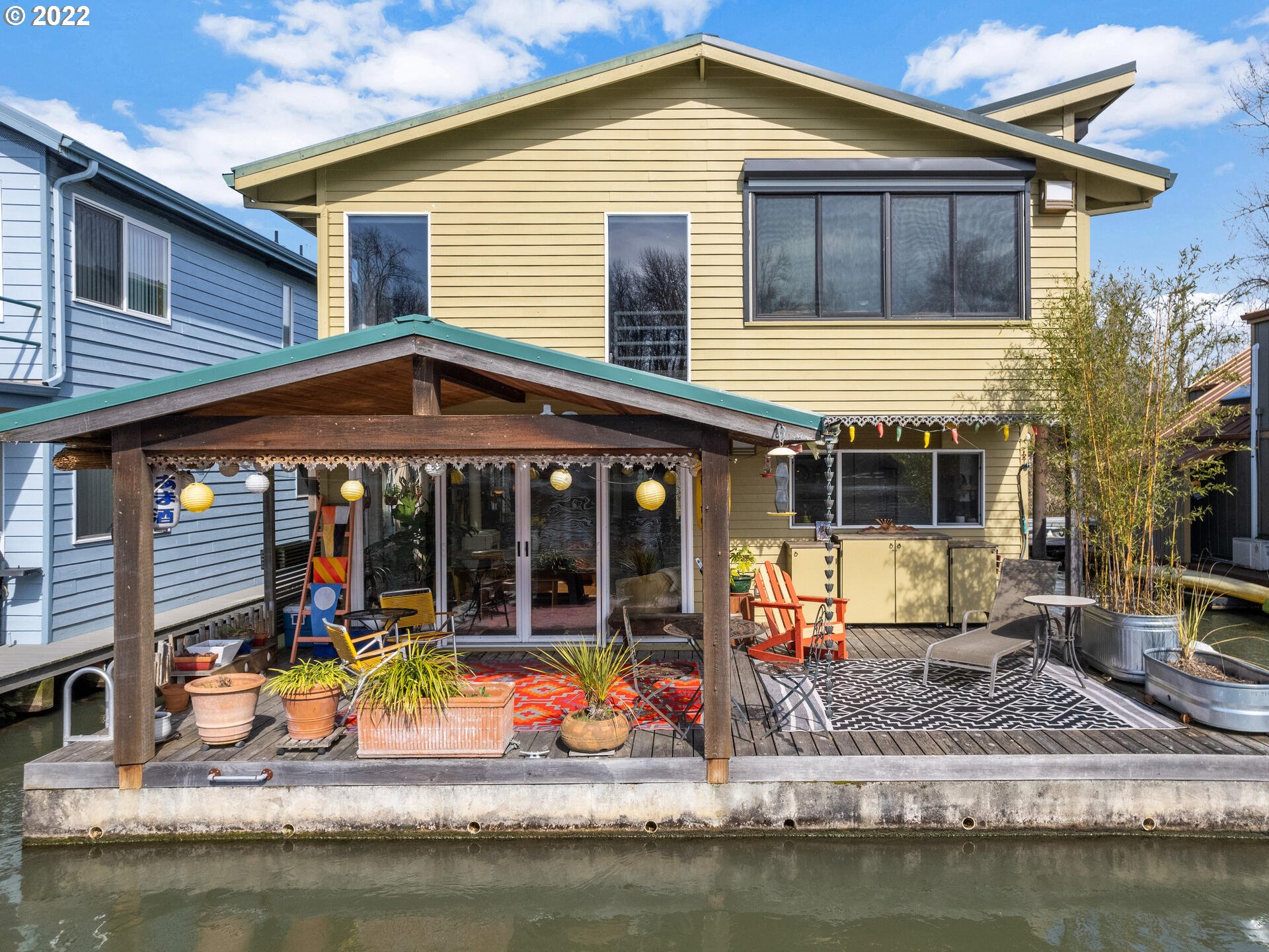 17617 Northwest Sauvie Island Road, Unit 39 Portland, OR 97231 - Photo 1 of 32 a view of a house with pool and chairs