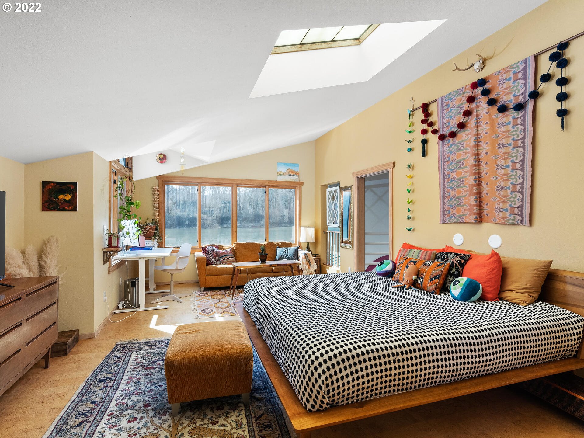 17617 Northwest Sauvie Island Road, Unit 39 Portland, OR 97231 - Photo 17 of 32 a bedroom with furniture and a large window