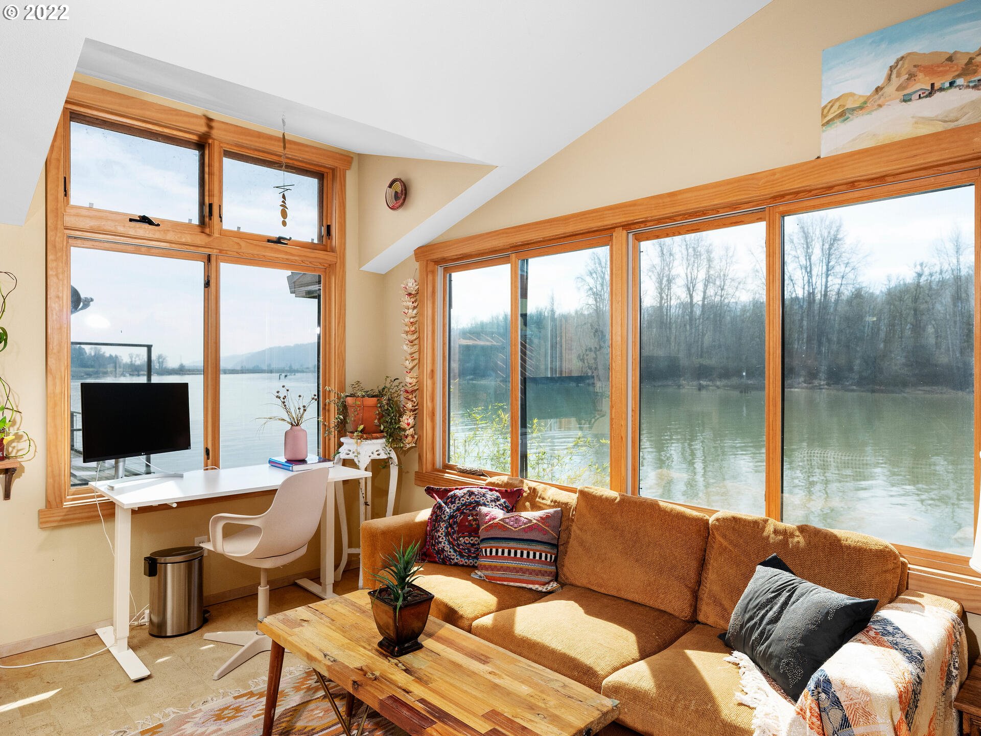 17617 Northwest Sauvie Island Road, Unit 39 Portland, OR 97231 - Photo 19 of 32 a living room with a large window and a table