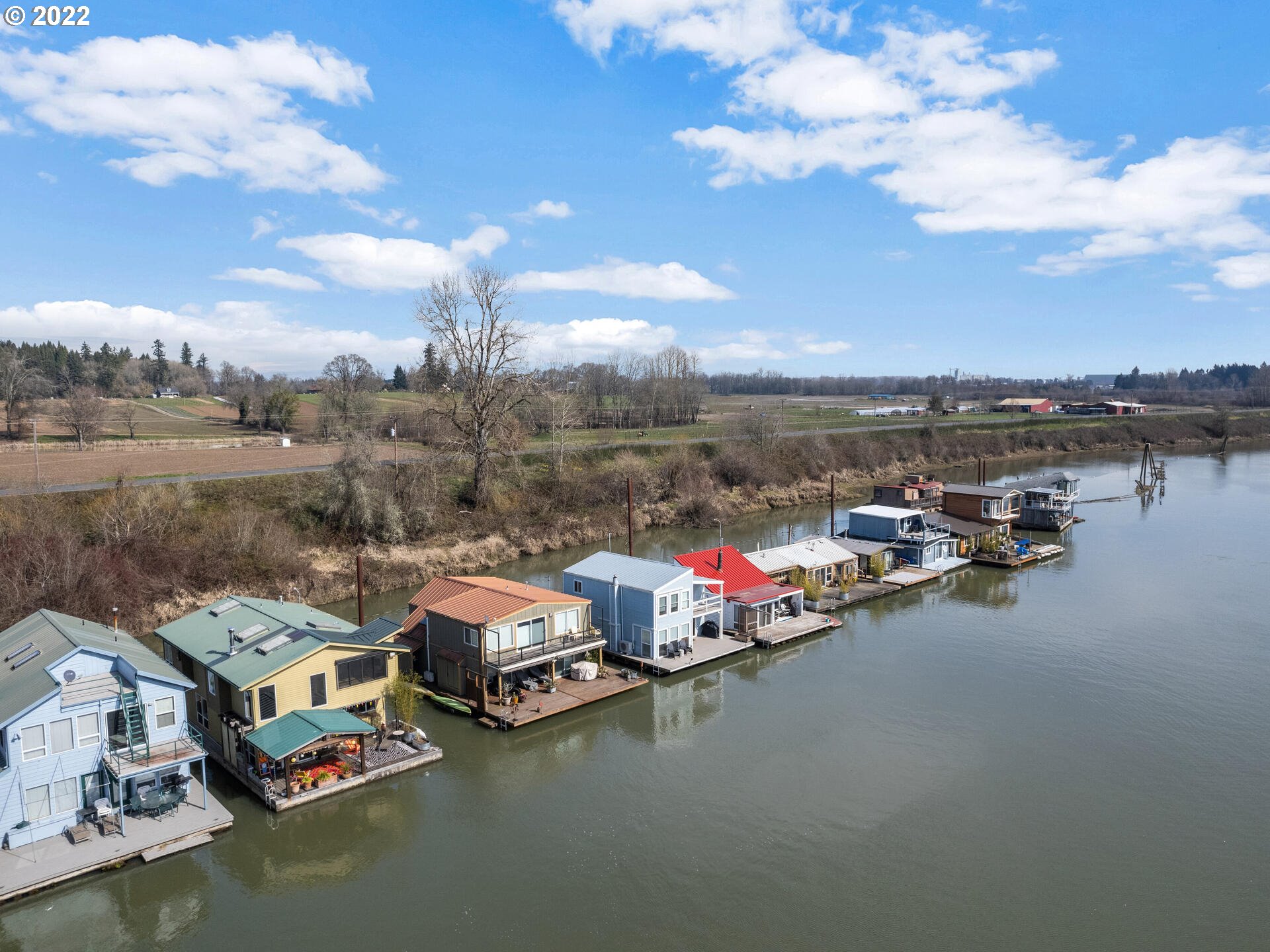 17617 Northwest Sauvie Island Road, Unit 39 Portland, OR 97231 - Photo 28 of 32 a view of a lake with cars parked