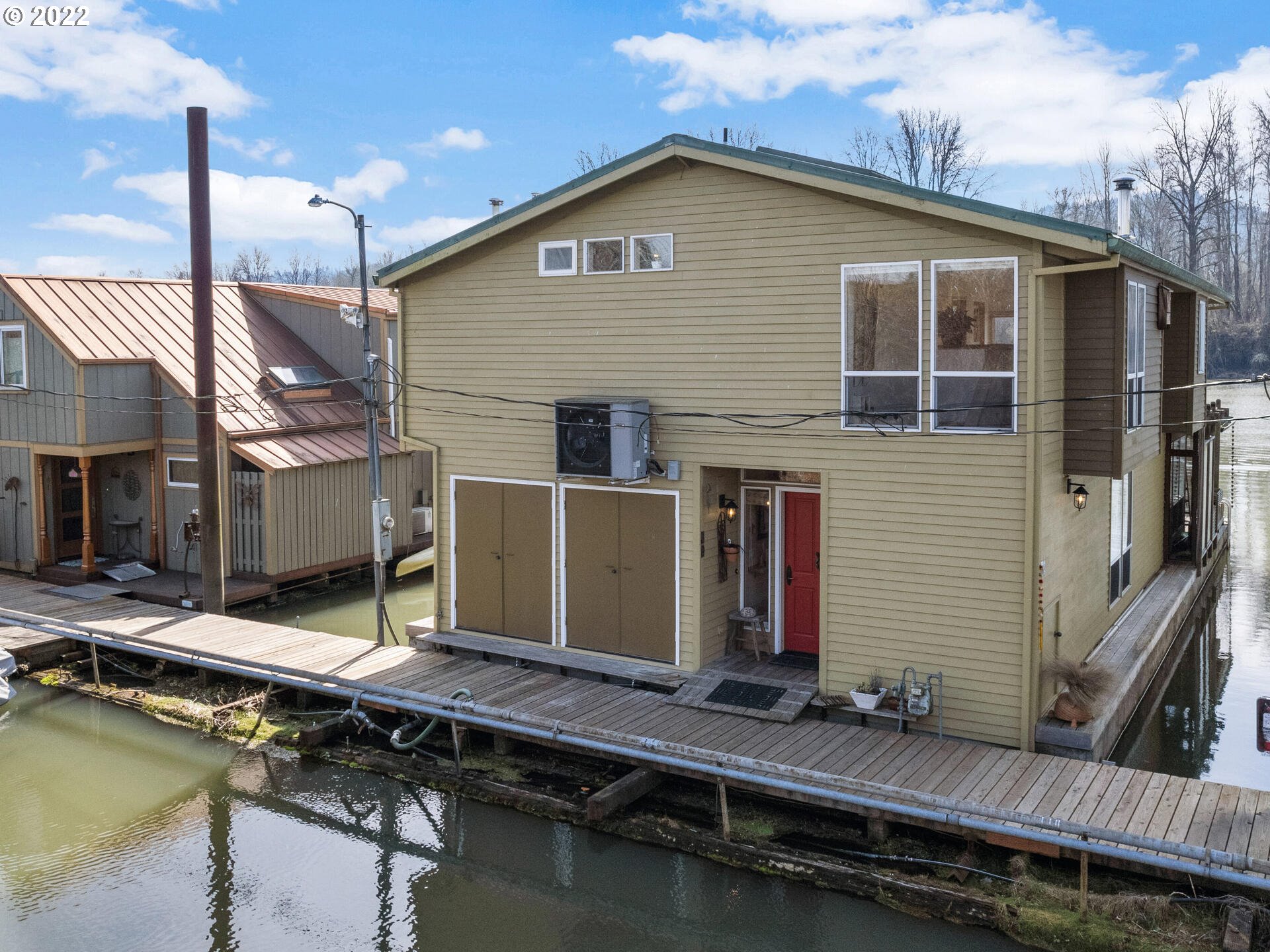 17617 Northwest Sauvie Island Road, Unit 39 Portland, OR 97231 - Photo 32 of 32 a front view of a house with swimming pool and porch