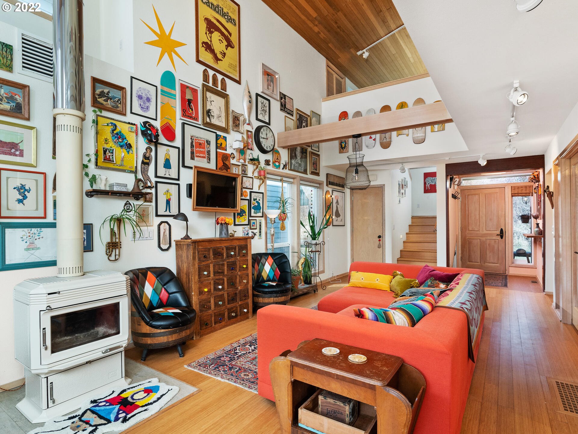 17617 Northwest Sauvie Island Road, Unit 39 Portland, OR 97231 - Photo 4 of 32 a play room with furniture a flat screen tv and a fireplace