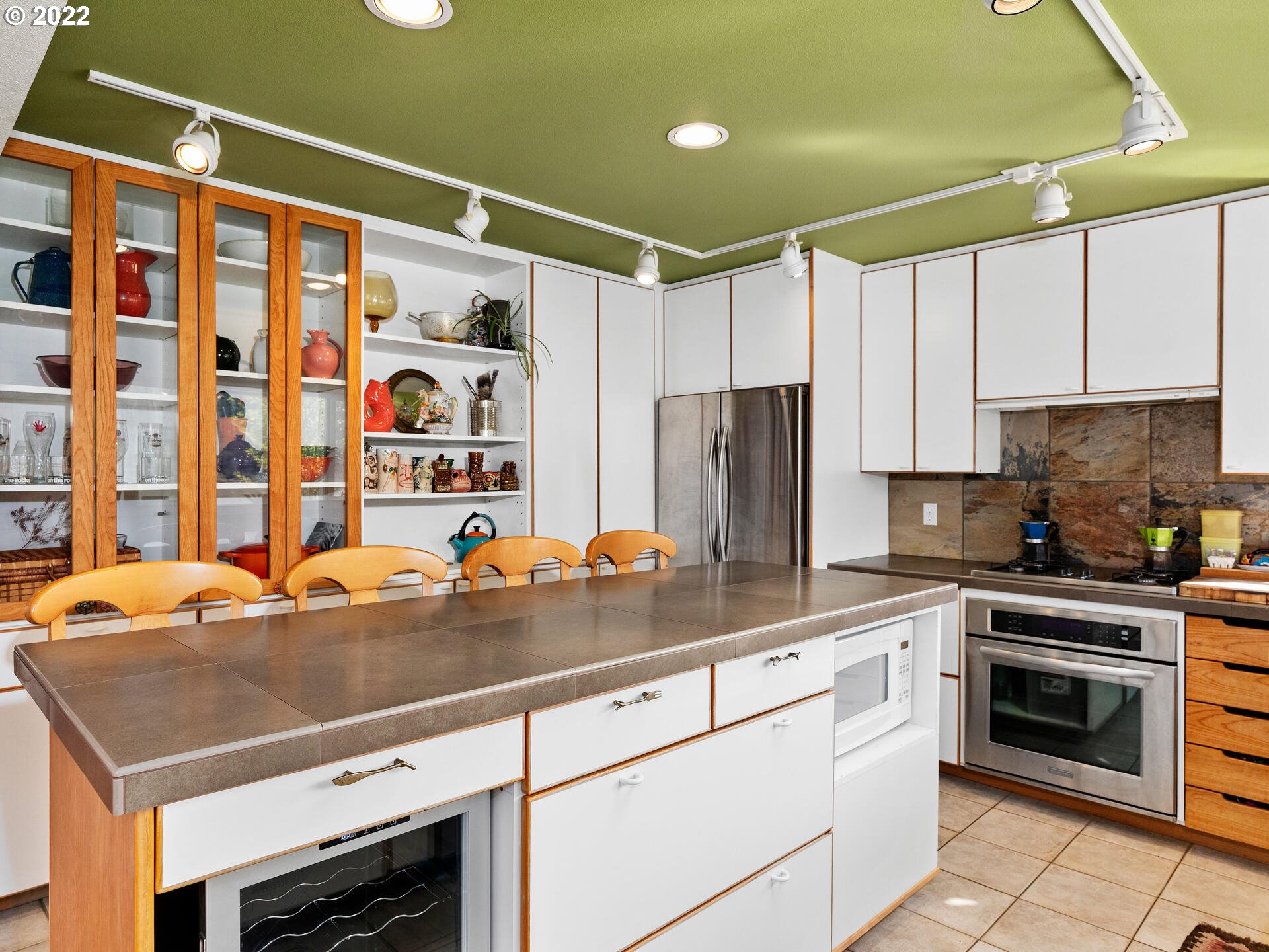 17617 Northwest Sauvie Island Road, Unit 39 Portland, OR 97231 - Photo 10 of 32 a kitchen with stainless steel appliances a stove a sink and a refrigerator