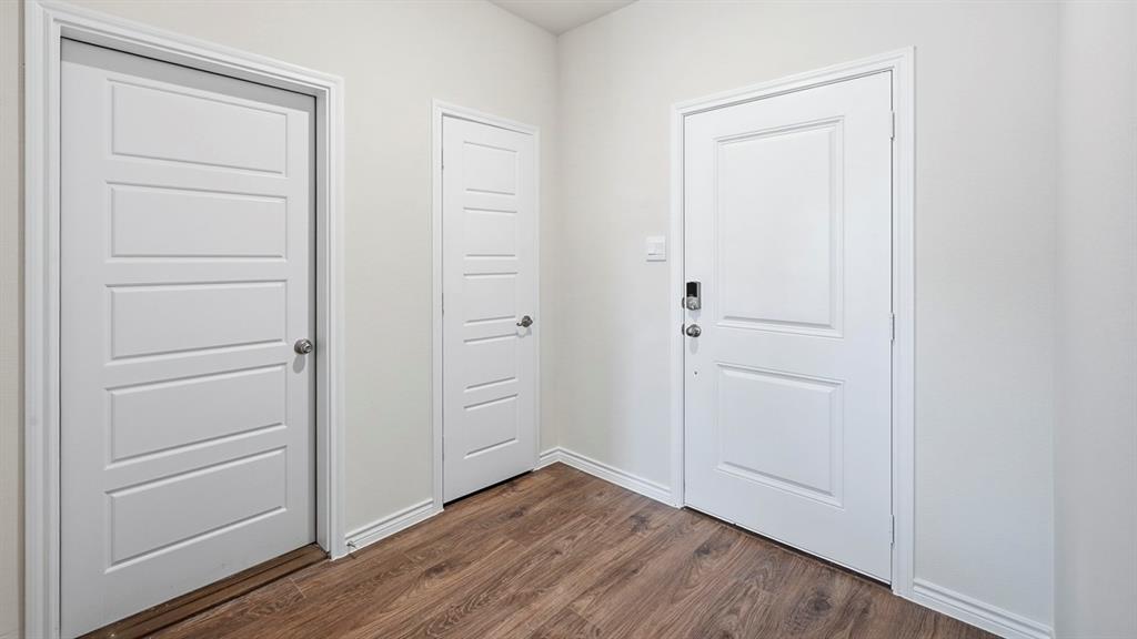 403 Flintlock Road Caddo Mills, TX 75135 - Photo 20 of 26 Doorway to outside featuring wood finished floors
