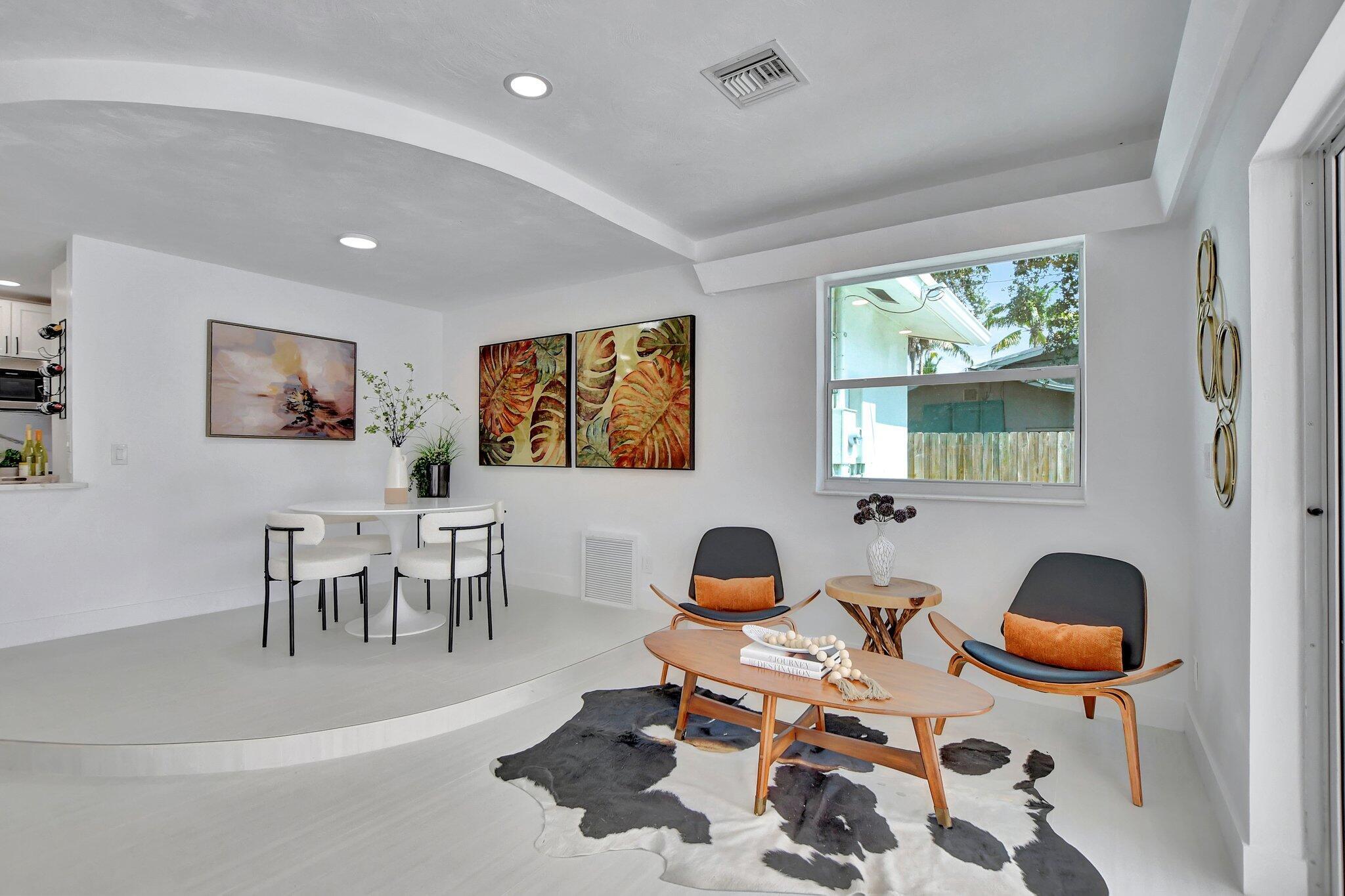 832 Southwest 10th Avenue Boca Raton, FL 33486 - Photo 19 of 57 a workspace with furniture a window and wooden floor