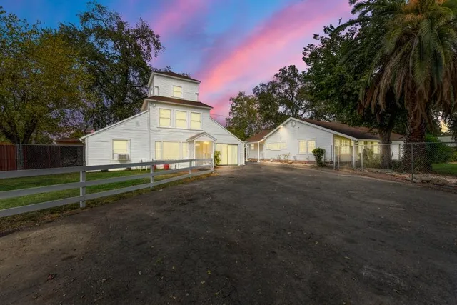 an aerial view of a house with outdoor space and street view