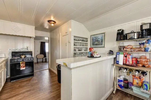 a view of a livingroom with furniture and a flat screen tv