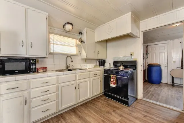 a bedroom with furniture and a flat screen tv