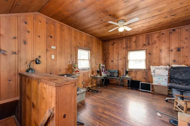 a living room with furniture a rug and a window
