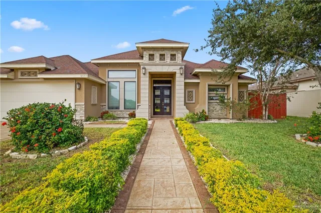 front view of a house with a yard