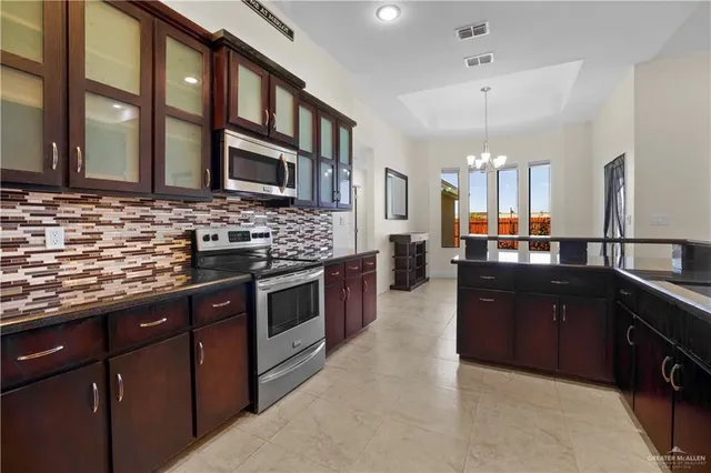 a kitchen with a refrigerator and a sink