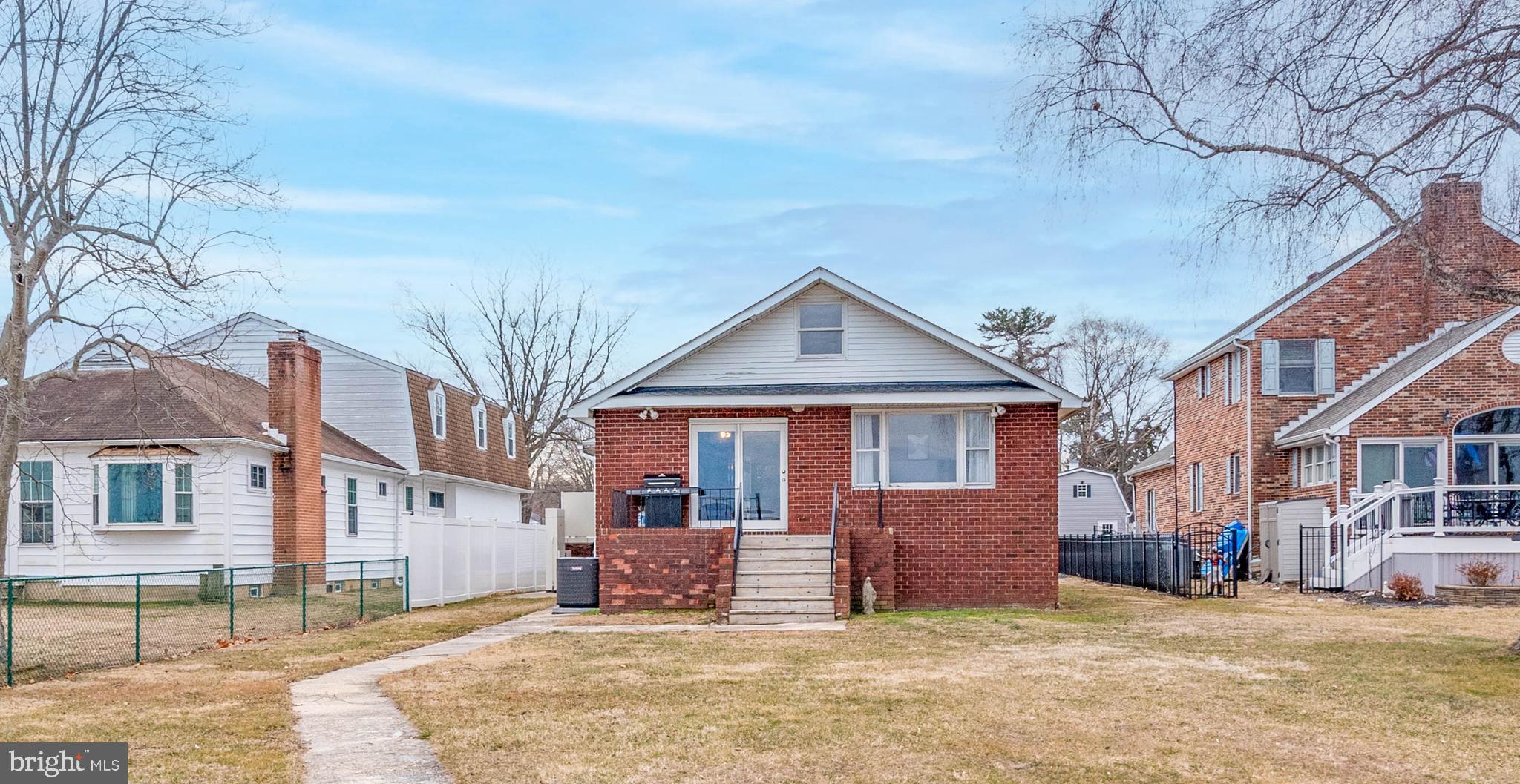 7316 Greenbank Road Baltimore, MD 21220 - Photo 2 of 87 a front view of a house with a yard and garage