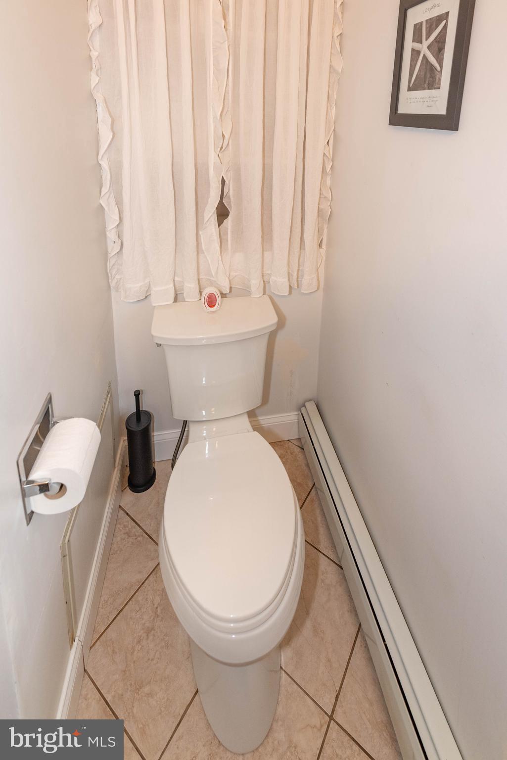 7316 Greenbank Road Baltimore, MD 21220 - Photo 23 of 87 a white toilet sitting next to a bathroom sink