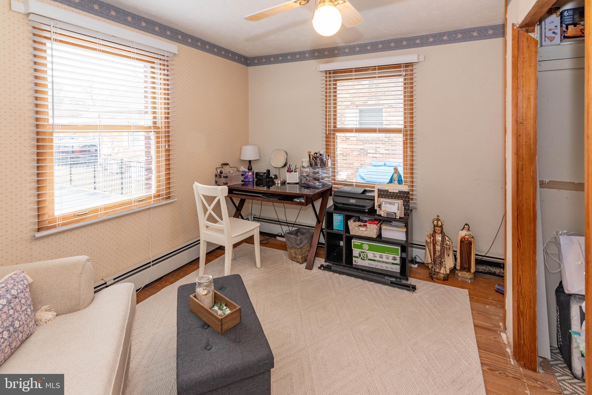 7316 Greenbank Road Baltimore, MD 21220 - Photo 24 of 87 a living room with furniture and a window