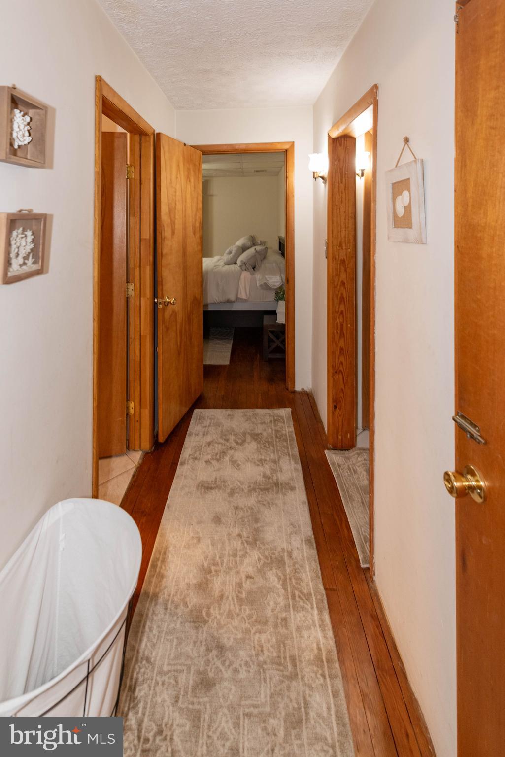 7316 Greenbank Road Baltimore, MD 21220 - Photo 27 of 87 a bedroom with a bed and wooden floor