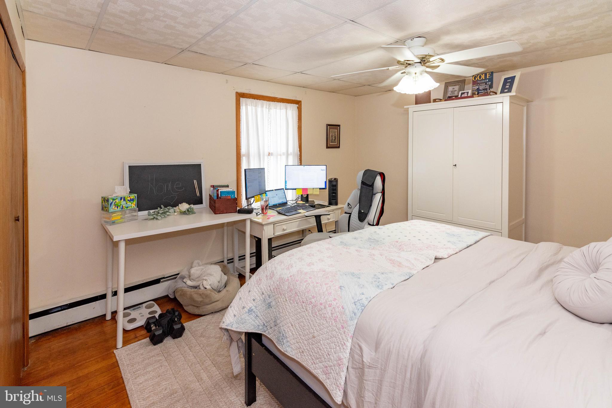 7316 Greenbank Road Baltimore, MD 21220 - Photo 28 of 87 a bedroom with a bed and a window