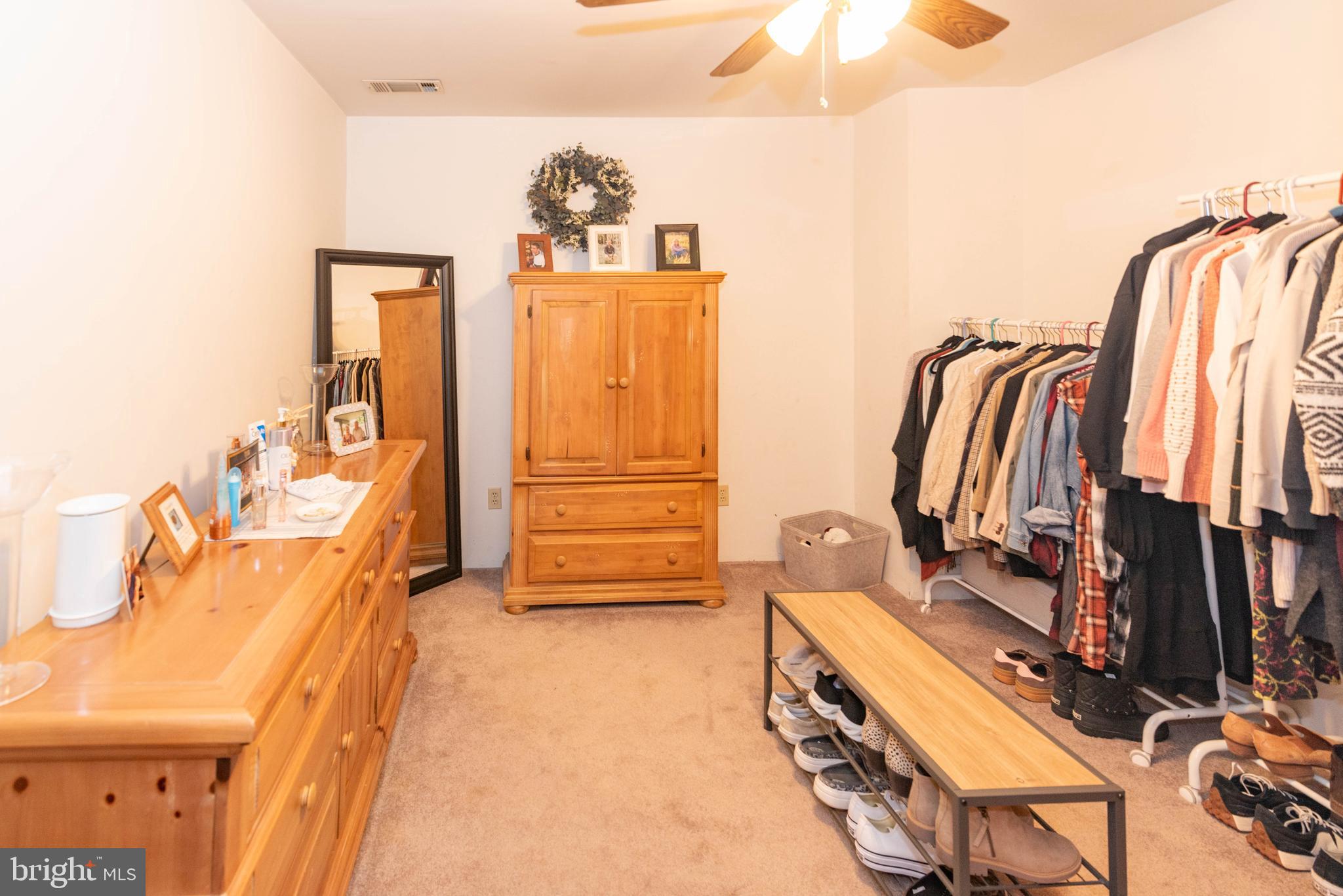 7316 Greenbank Road Baltimore, MD 21220 - Photo 31 of 87 a view of walk in closet with clothes