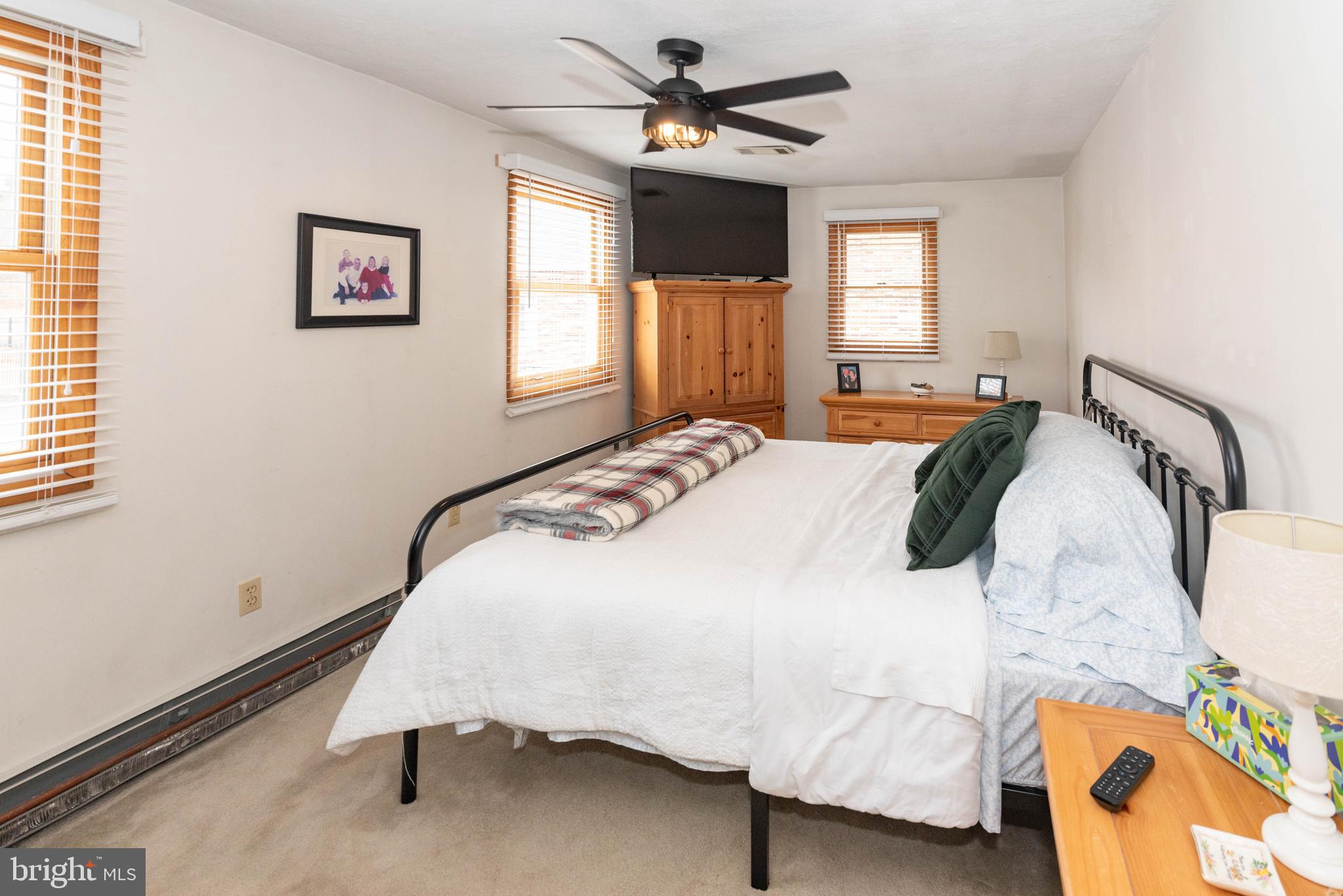 7316 Greenbank Road Baltimore, MD 21220 - Photo 33 of 87 a bedroom with a bed dresser and a window