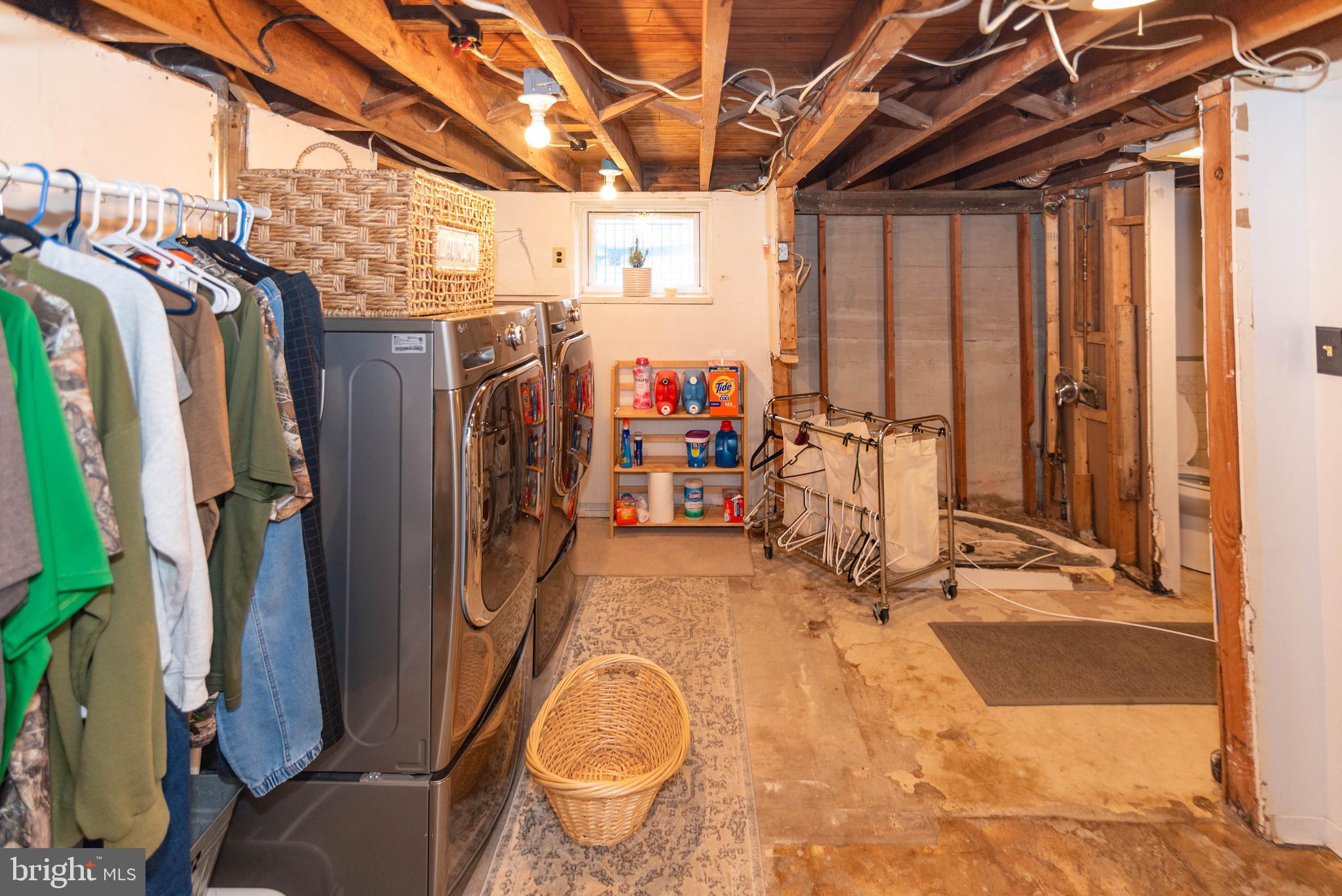7316 Greenbank Road Baltimore, MD 21220 - Photo 47 of 87 a view of a storage room with water heater and racks