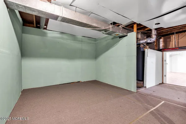 a view of a room with wooden walls