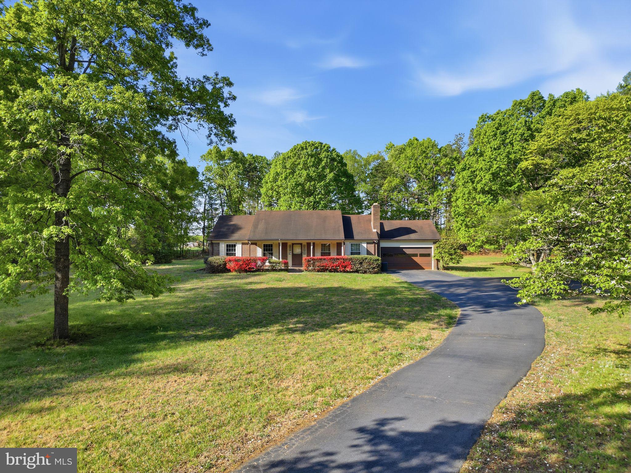 4201 Goldmine Road Goldvein, VA 22720 - Photo 2 of 10 Charming home nestled in lush greenery.