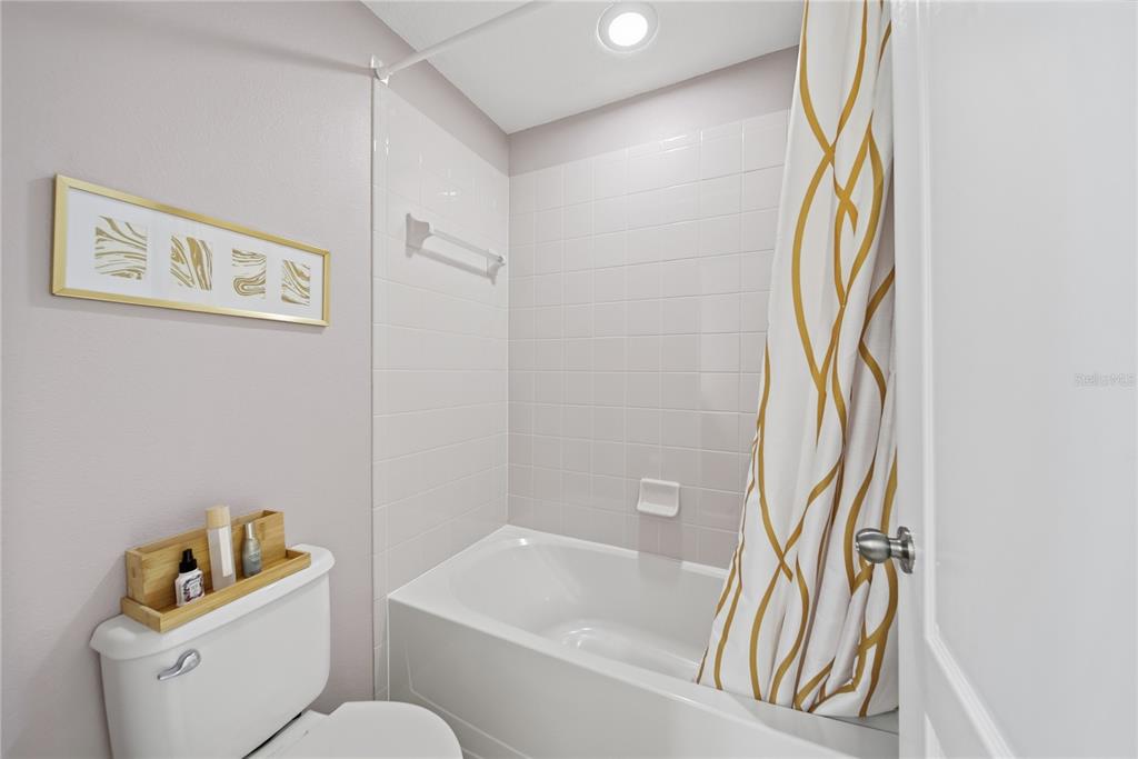 8605 Fiddleleaf Court Tampa, FL 33647 - Photo 17 of 26 a bathroom with a sink and a toilet