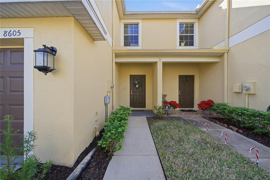 8605 Fiddleleaf Court Tampa, FL 33647 - Photo 2 of 26 a front view of a house with yard