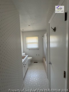 338 Summerhill Road Fayetteville, NC 28303 - Photo 9 of 28 a bathroom with a toilet sink and a mirror
