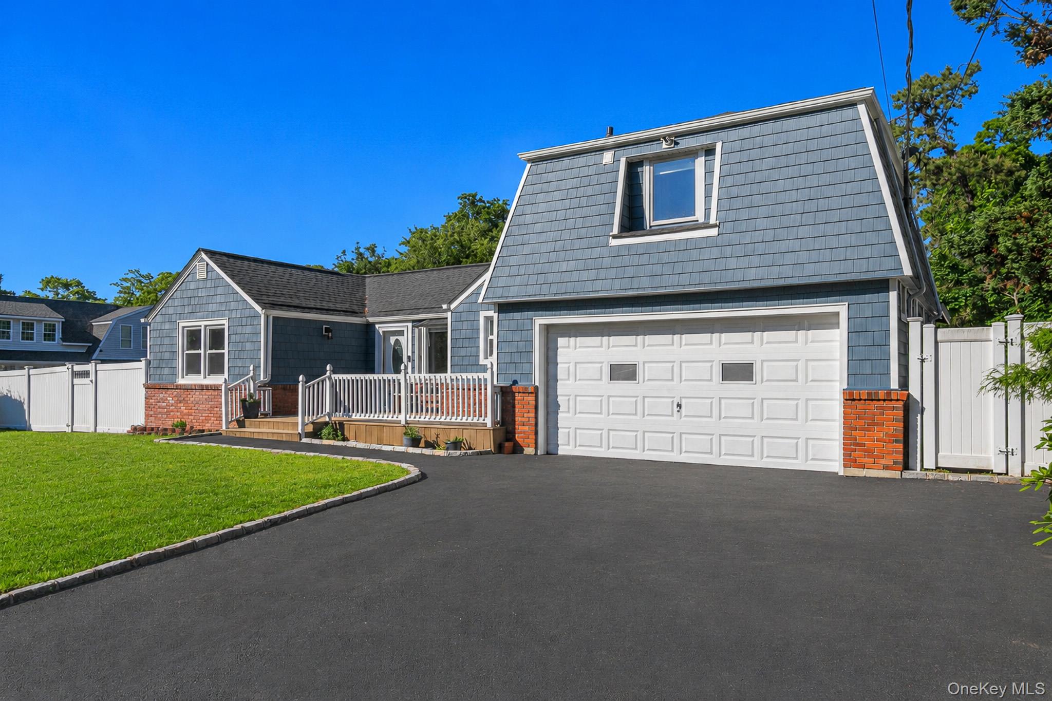 33 Lillian Road Nesconset, NY 11767 - Photo 3 of 42 The Home Offers An Oversized 4+ Car Driveway, Belgium Block Lining/Trim & Belgium Block Lined Walkway, Large Front Composite/Trex Porch With PVC Railings & A Large Two Car Garage.