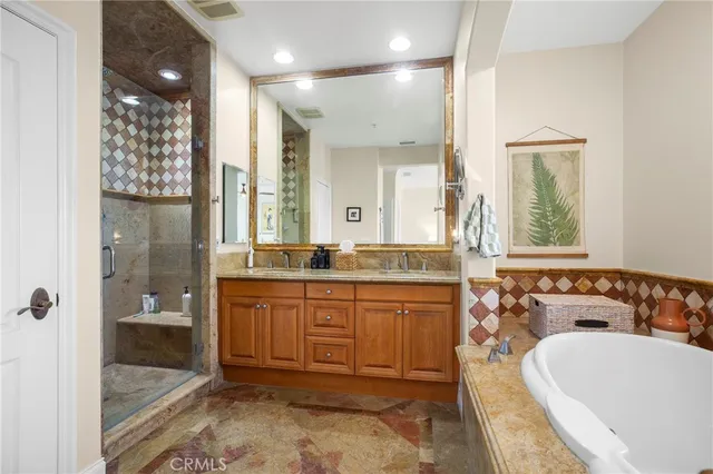 a bedroom with a bed and a night stand