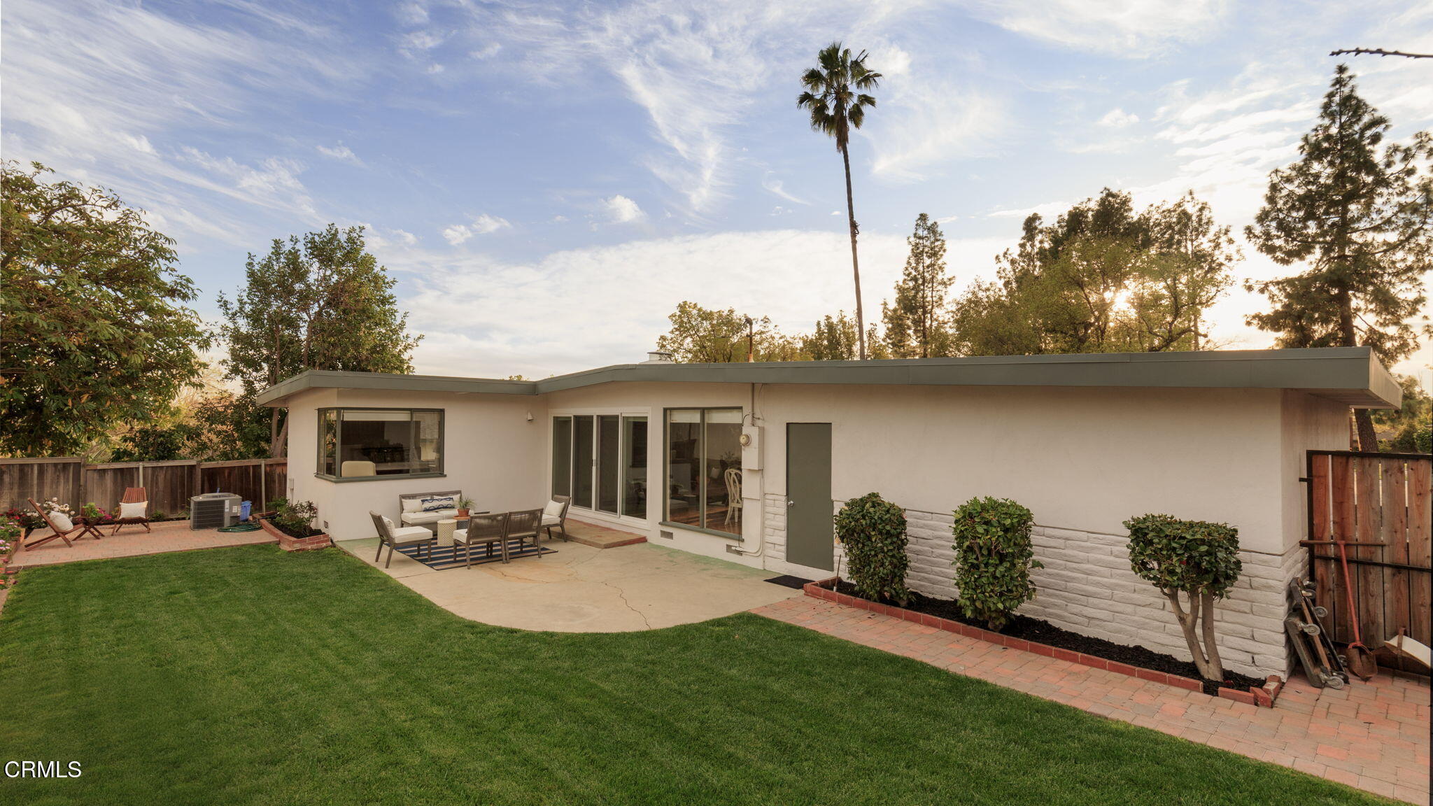 1190 Riviera Drive Pasadena, CA 91107 - Photo 17 of 36 a view of a patio with table and chairs potted plants with wooden fence