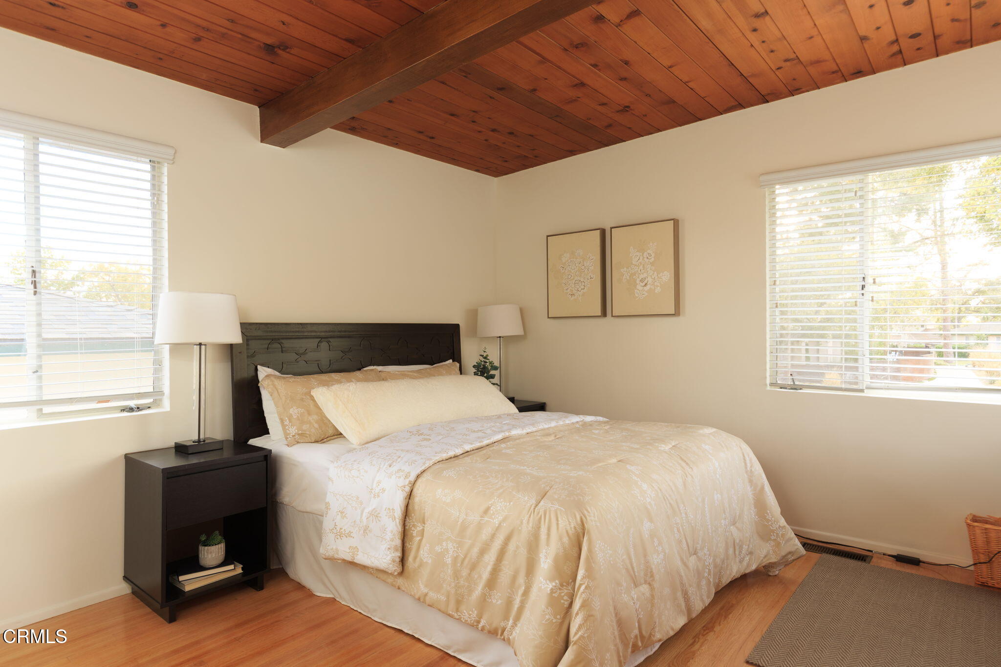 1190 Riviera Drive Pasadena, CA 91107 - Photo 27 of 36 a bedroom with a bed and wooden floor