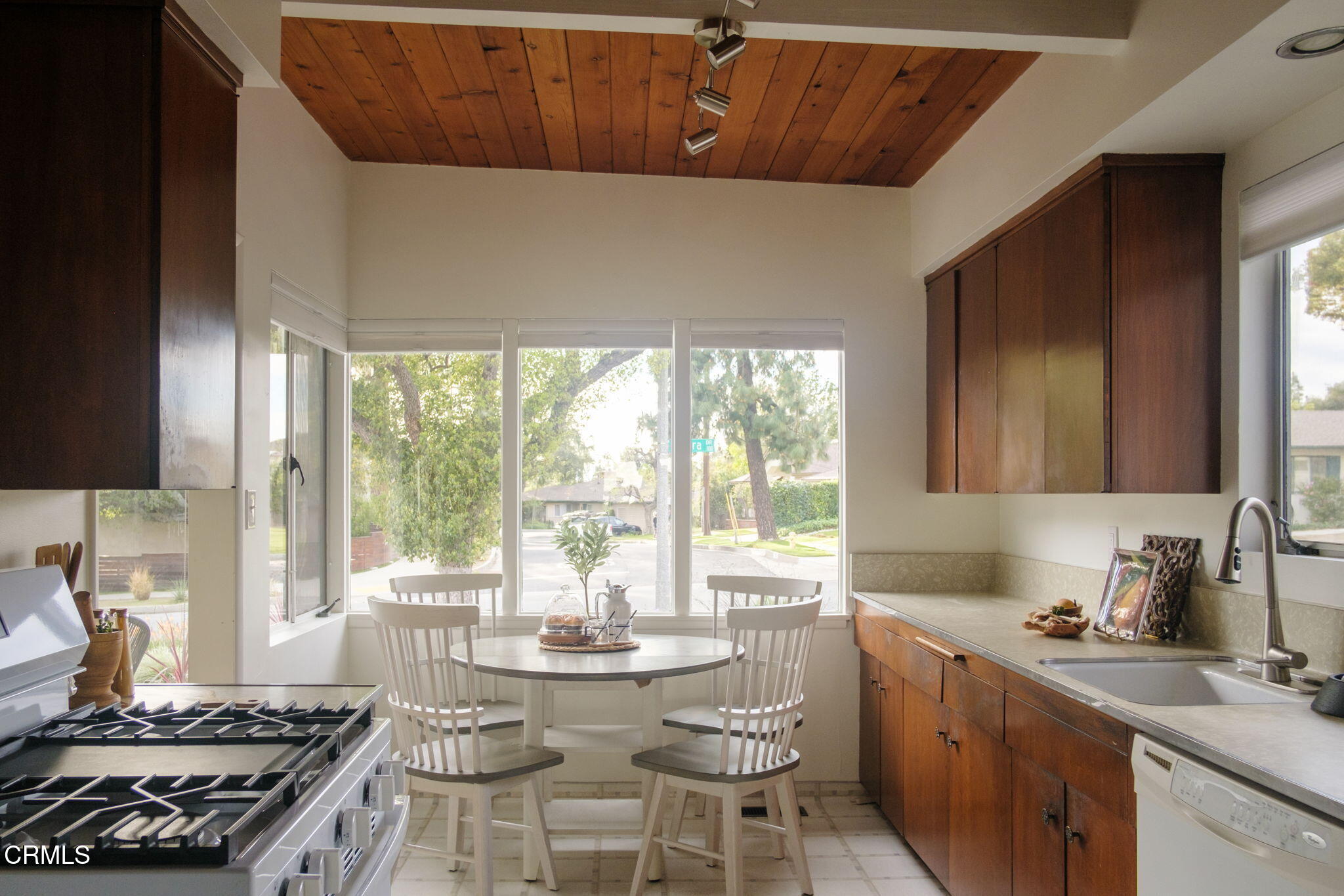 1190 Riviera Drive Pasadena, CA 91107 - Photo 6 of 36 a kitchen with a stove a sink and a wooden cabinets