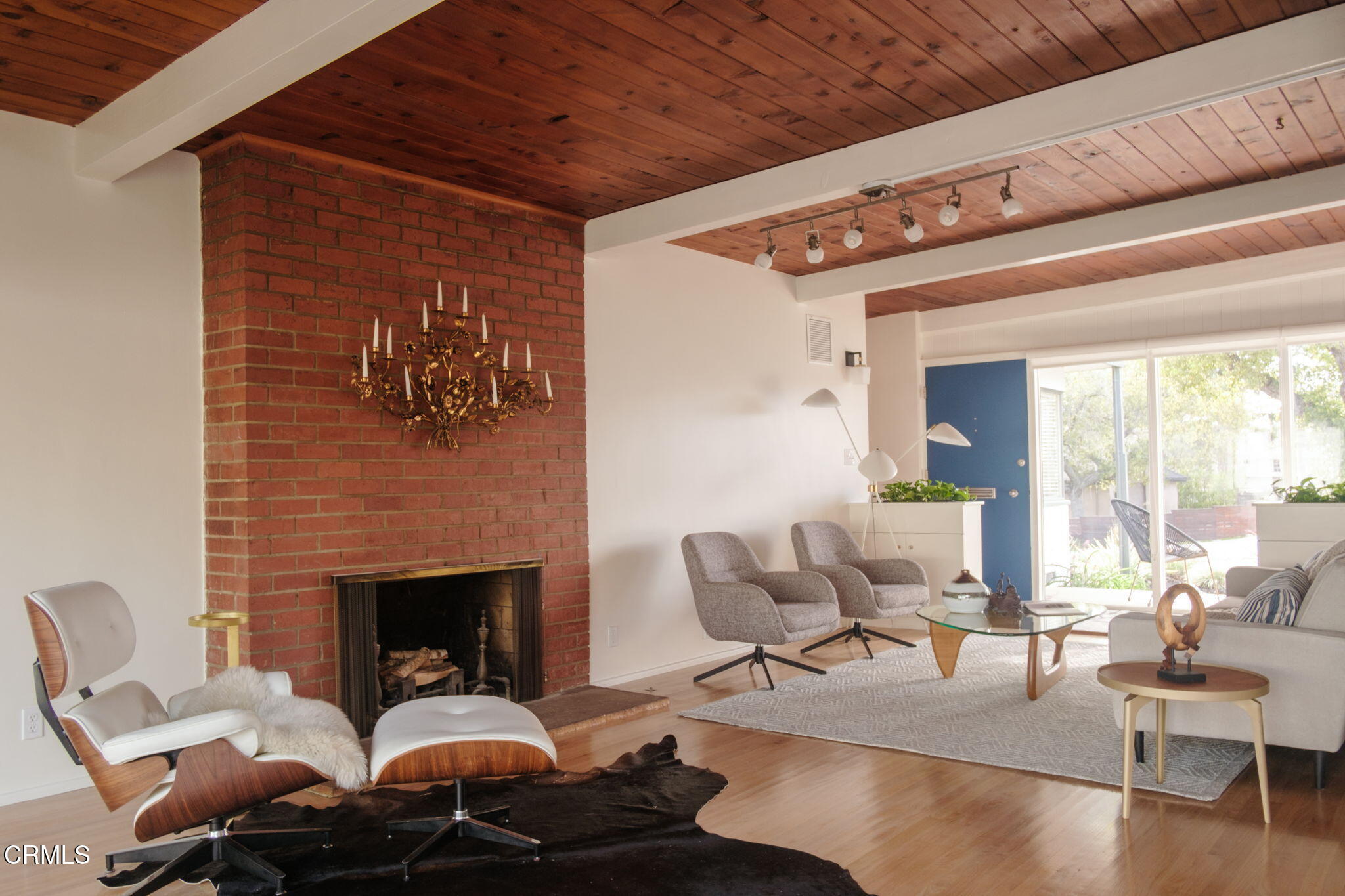 1190 Riviera Drive Pasadena, CA 91107 - Photo 10 of 36 a living room with furniture a fireplace and a floor to ceiling window